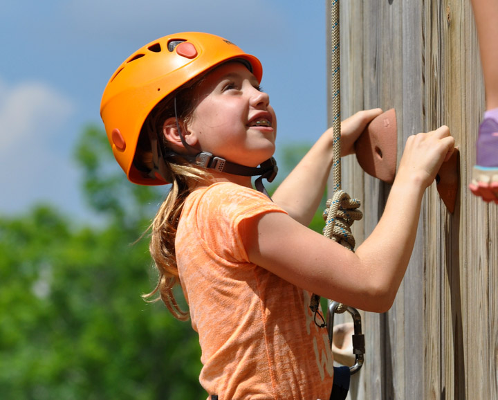 young-girl-climbing-wall